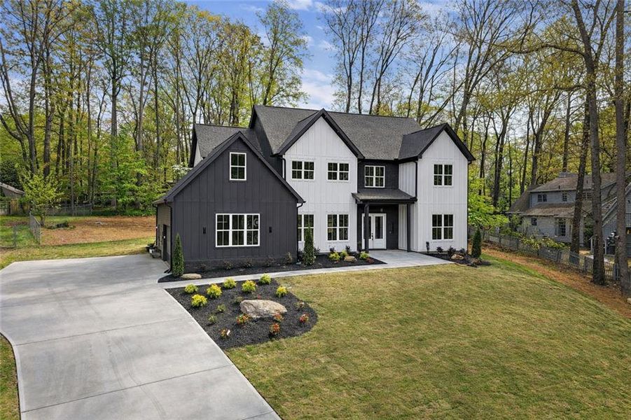 Front exterior of a new home in , Marietta, GA, highlighting curb appeal (Image 2). Front exterior of a new home in , Marietta, GA, highlighting curb appeal (Image 2).