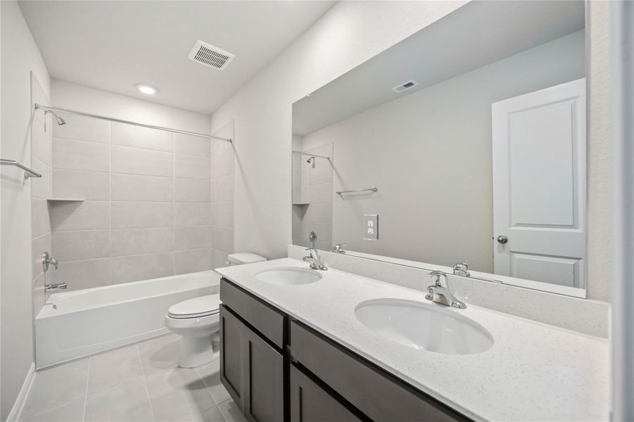 Furnished interior view inside a new home in Sunterra, Katy (Image 8).