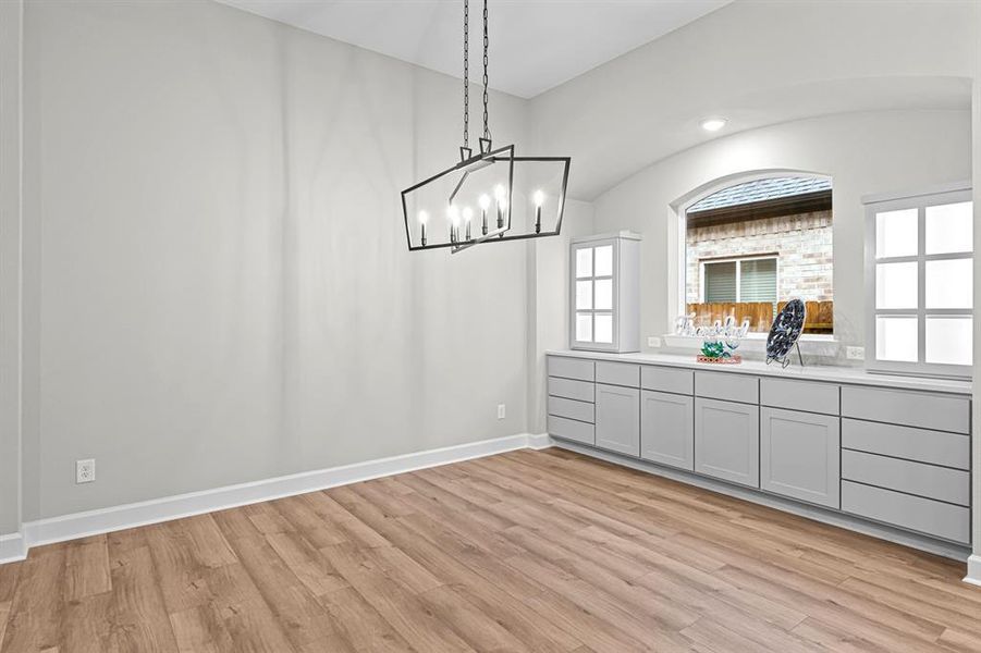 Another view of this beautiful and spacious Dining room with room for a table for 8!