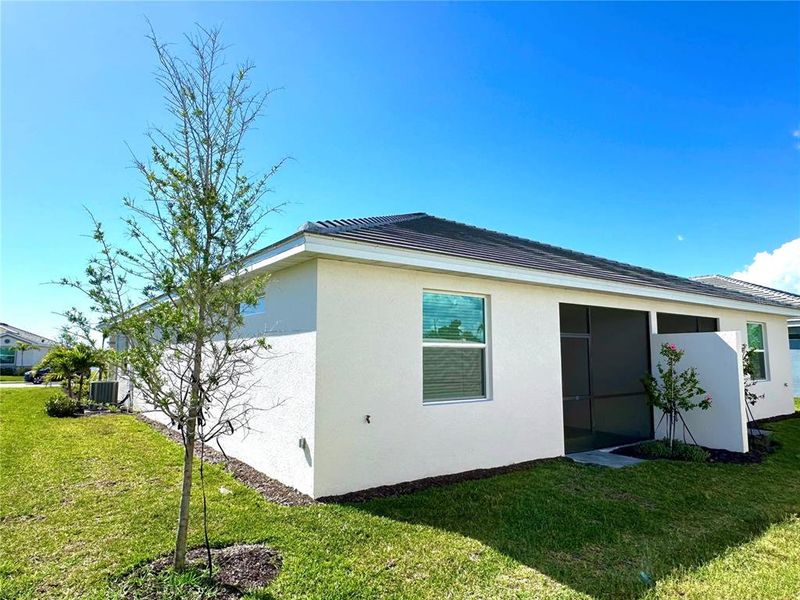 Exterior details and patio area of a home in Palm Lake at Coco Bay, Englewood (Image 24).