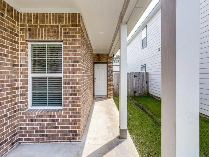 Exterior details and patio area of a home in , Conroe (Image 22).