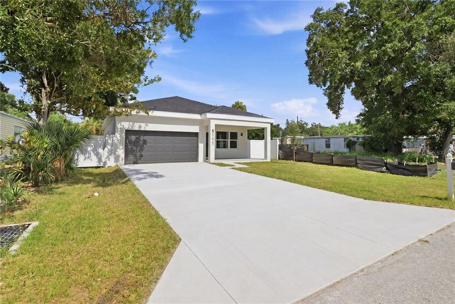Front exterior of a new home in , St. Petersburg, FL, highlighting curb appeal (Image 2). Front exterior of a new home in , St. Petersburg, FL, highlighting curb appeal (Image 2).