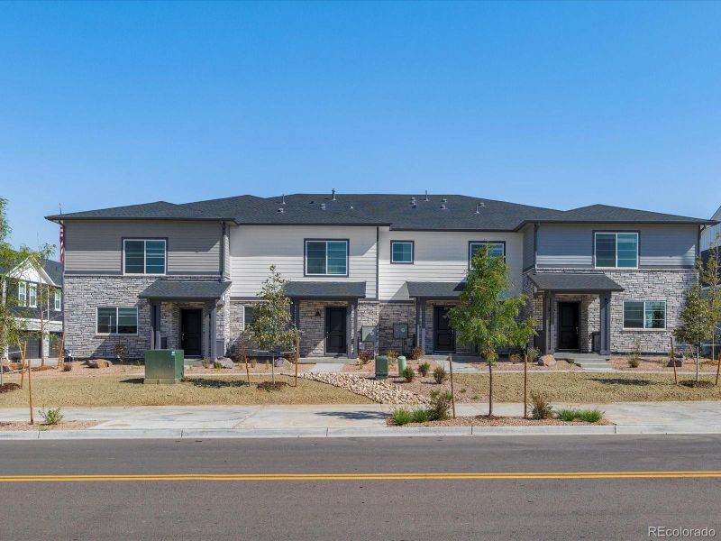 Front exterior of a new home in Skyview at High Point, Aurora, CO, highlighting curb appeal (Image 23).