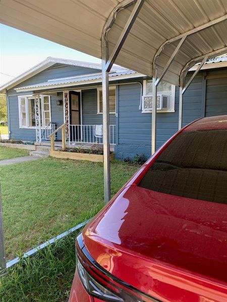 View of front of home with a front yard and a porch View of front of home with a front yard and a porch