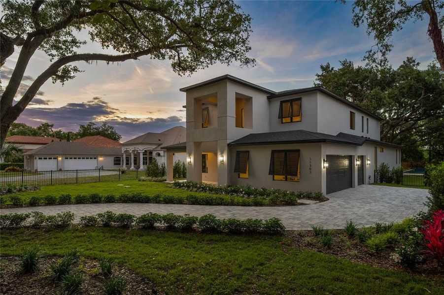 Front exterior of a new home in , Windermere, FL, highlighting curb appeal (Image 24).