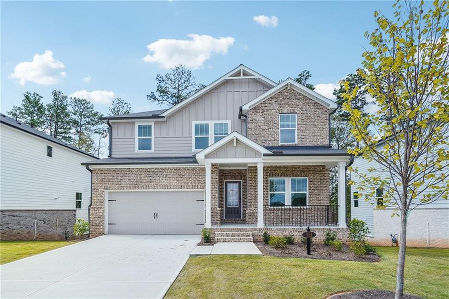 Front exterior of a new home in Martin Springs - Estate Series, Lawrenceville, GA, highlighting curb appeal (Image 2).