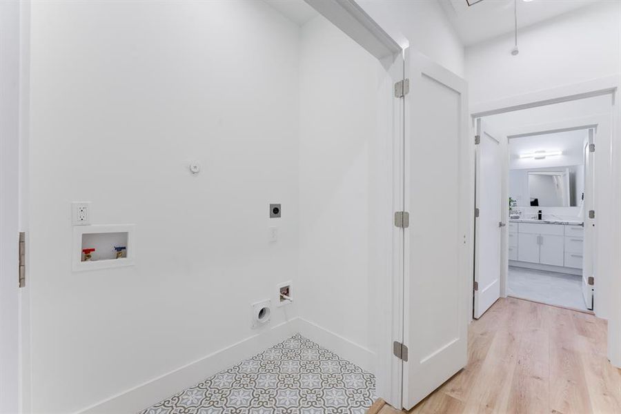 Elegant double door utility room with stylish tile flooring.