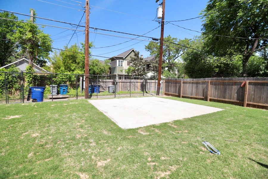 Fenced backyard with a patio area