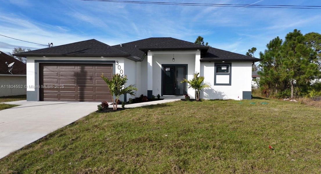Front exterior of a new home in , Lehigh Acres, FL, highlighting curb appeal (Image 1). Front exterior of a new home in , Lehigh Acres, FL, highlighting curb appeal (Image 1).