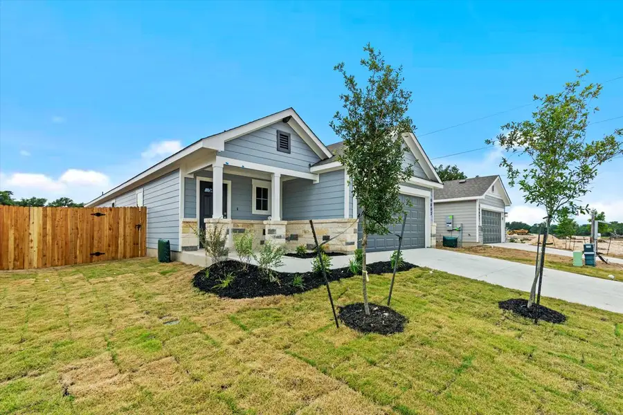 Front exterior of a new home in Yowell Ranch, Killeen, TX, highlighting curb appeal (Image 2). Front exterior of a new home in Yowell Ranch, Killeen, TX, highlighting curb appeal (Image 2).