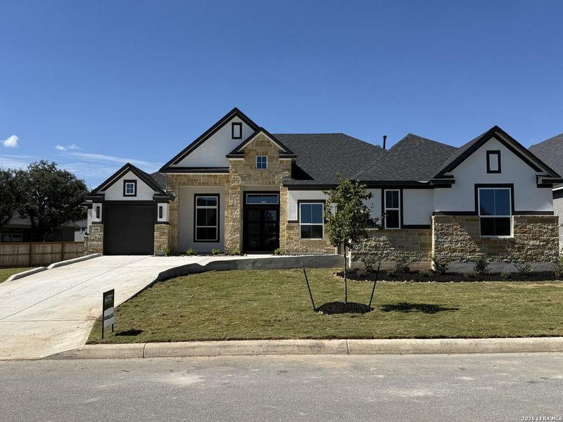 Front exterior of a new home in , Castroville, TX, highlighting curb appeal (Image 2). Front exterior of a new home in , Castroville, TX, highlighting curb appeal (Image 2).