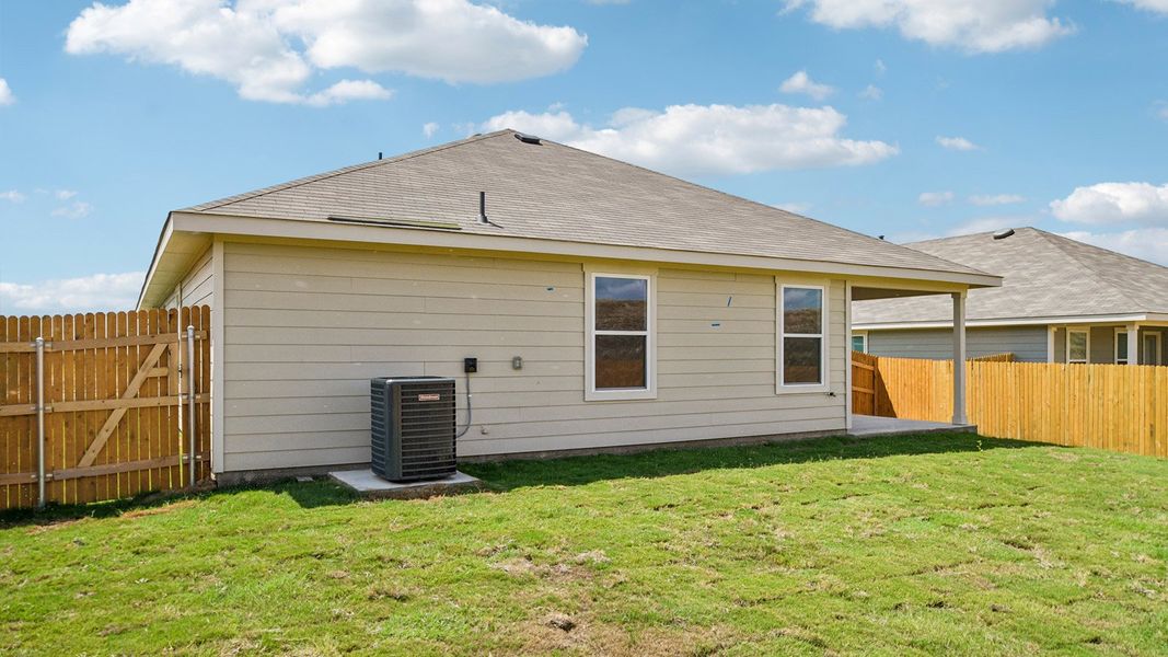 Exterior details and patio area of a home in Prairie Lakes, Buda (Image 4).