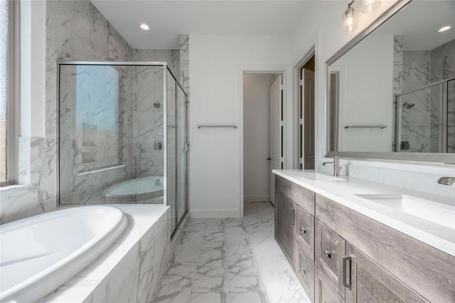 Primary bath with separate bathtub and shower, and double sinks