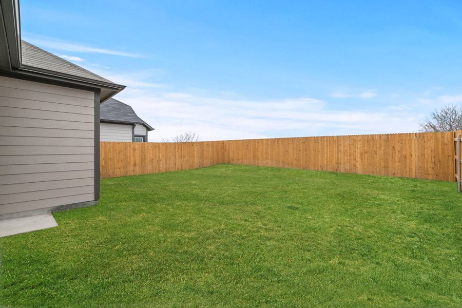 Exterior details and patio area of a home in Trinity Ranch, Elgin (Image 3). Exterior details and patio area of a home in Trinity Ranch, Elgin (Image 3).