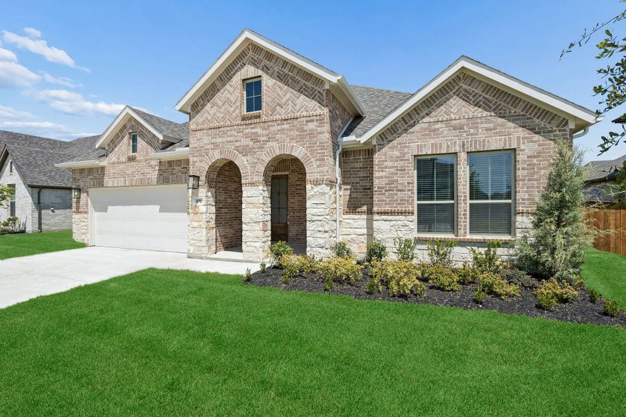 Front exterior of a new home in Dove Hollow, Waxahachie, TX, highlighting curb appeal (Image 2). Front exterior of a new home in Dove Hollow, Waxahachie, TX, highlighting curb appeal (Image 2).