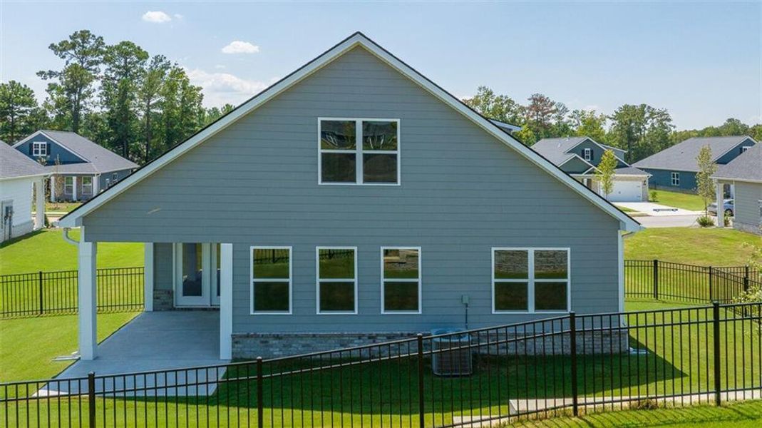 Exterior details and patio area of a home in Oak Ridge Meadows - Active Adult, Locust Grove (Image 2).