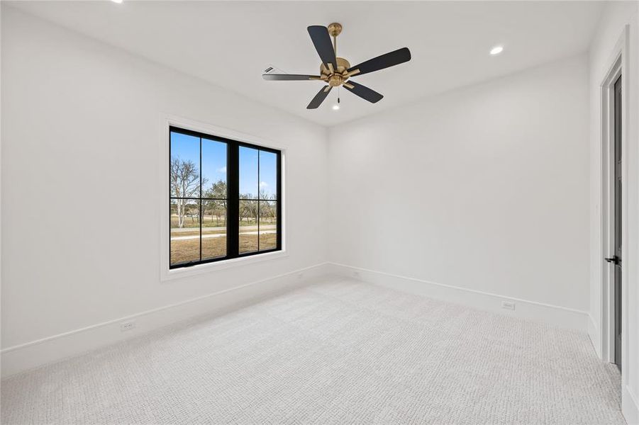 Carpeted spare room with recessed lighting and a ceiling fan
