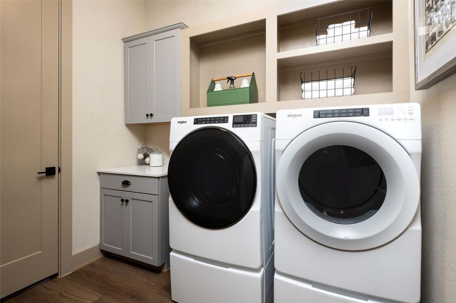 The laundry room layout is carefully planned for optimal workflow with designated areas for washing, drying, and storing. The laundry room layout is carefully planned for optimal workflow with designated areas for washing, drying, and storing.