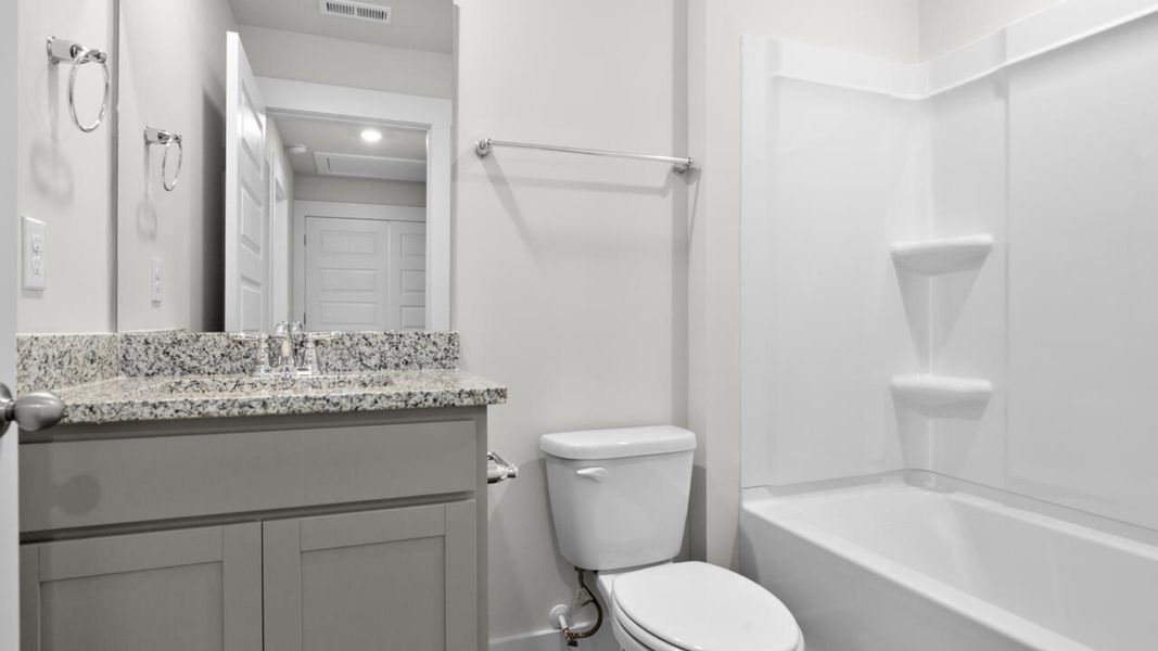 Furnished interior view inside a new home in Waterside Townhomes, Surf City (Image 11). Furnished interior view inside a new home in Waterside Townhomes, Surf City (Image 11).