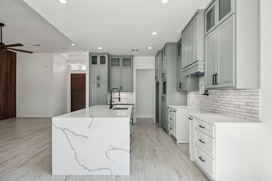 Waterfall island? Yes please!! Take a look at the extra touch of glass cabinets in the top row, you can display your favorite dishes or decor to create your perfect home vibe. Waterfall island? Yes please!! Take a look at the extra touch of glass cabinets in the top row, you can display your favorite dishes or decor to create your perfect home vibe.