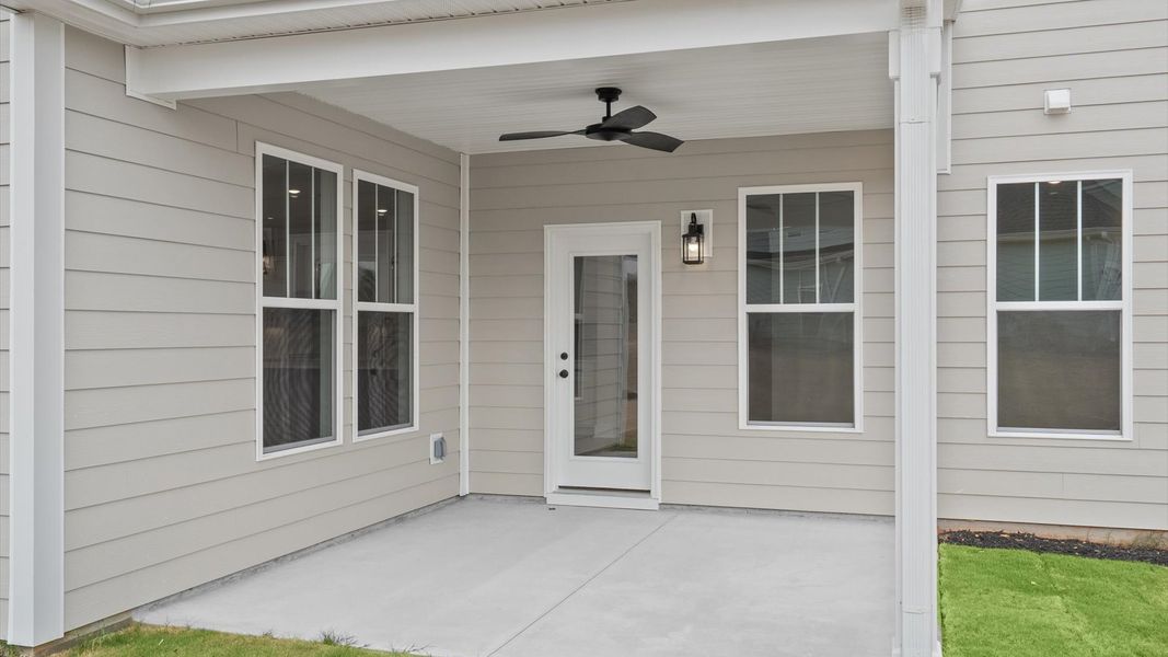 Notable exterior includes a rear covered porch designed for year-round enjoyment