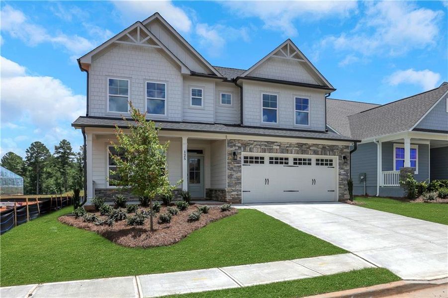 Front exterior of a new home in Twin Lakes, Hoschton, GA, highlighting curb appeal (Image 25). Front exterior of a new home in Twin Lakes, Hoschton, GA, highlighting curb appeal (Image 25).