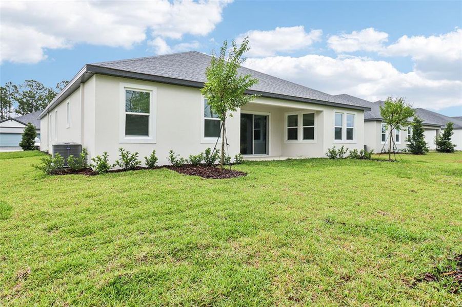 Exterior details and patio area of a home in Ridgehaven - Reserve Series, Ormond Beach (Image 3).
