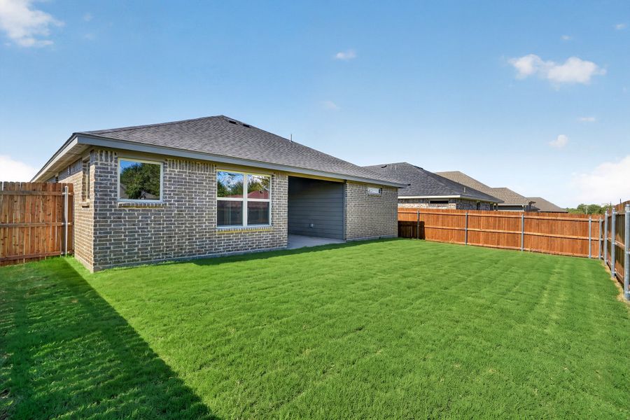 Exterior details and patio area of a home in Craftsman's Corner, Cleburne (Image 26).
