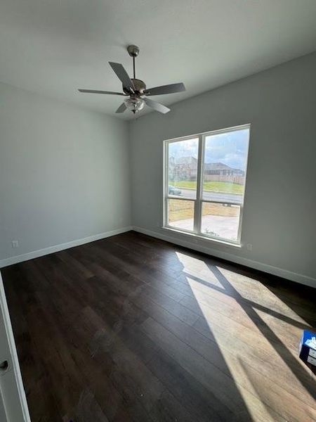 Empty room featuring dark wood-style floors
