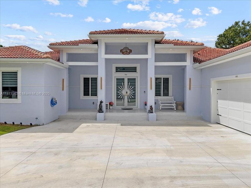 Front exterior of a new home in , Lehigh Acres, FL, highlighting curb appeal (Image 20).