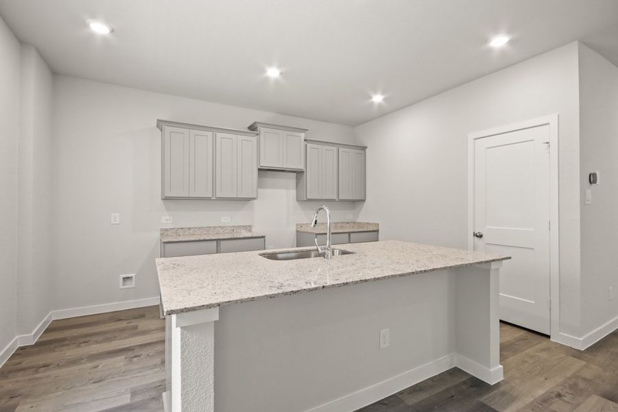 A kitchen with white cabinets. A kitchen with white cabinets.
