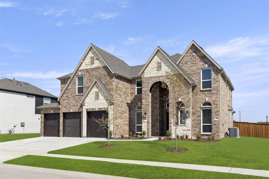 Front exterior of a new home in Polo Ridge, Mesquite, TX, highlighting curb appeal (Image 2). Front exterior of a new home in Polo Ridge, Mesquite, TX, highlighting curb appeal (Image 2).