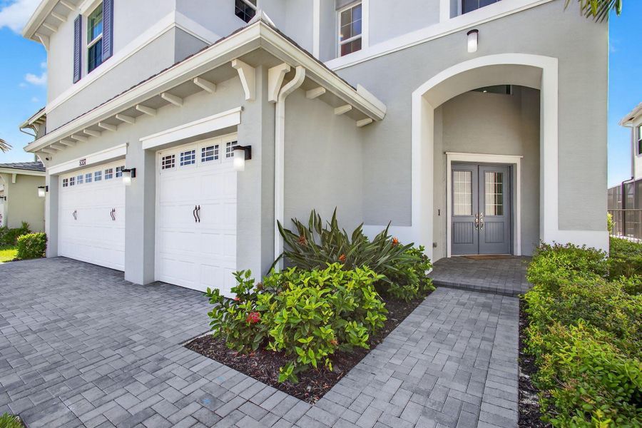 Front exterior of a new home in , The Acreage, FL, highlighting curb appeal (Image 25).
