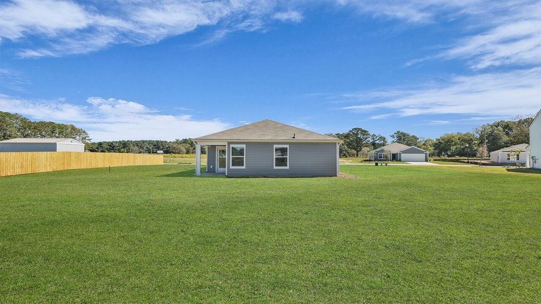 Exterior details and patio area of a home in Evergreen, Holly Hill (Image 3).