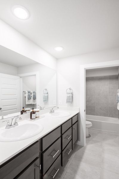 Representative furnished interior of a home built from the Yellowstar by Tri Pointe Homes in Mason Woods, Cypress (Image 14).