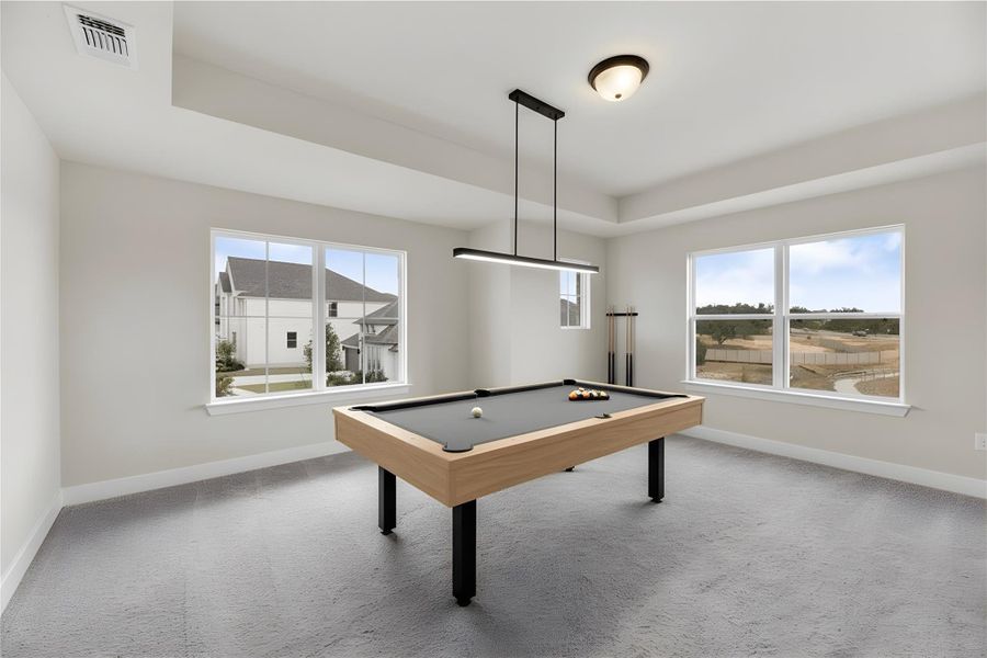 Rec room featuring billiards, light carpet, and plenty of natural light