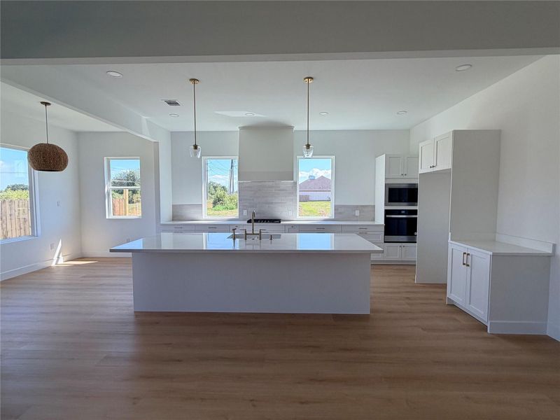 Large entertainer's kitchen with oversized island.