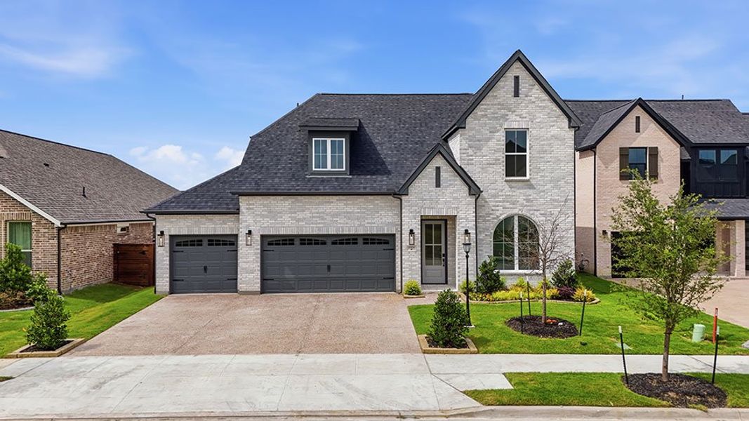 Front exterior of a new home in Solterra Texas, Mesquite, TX, highlighting curb appeal (Image 1). Front exterior of a new home in Solterra Texas, Mesquite, TX, highlighting curb appeal (Image 1).