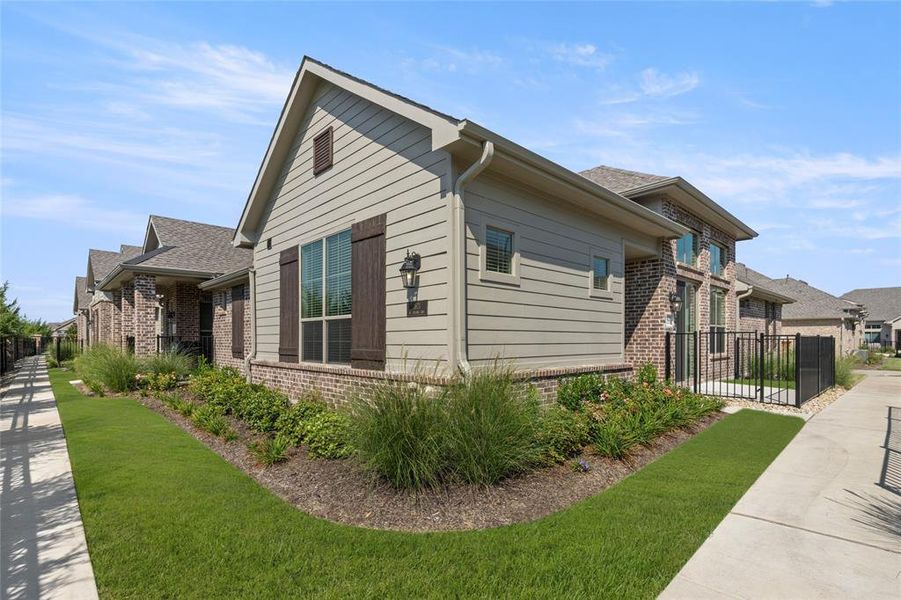 Front exterior of a new home in Mira Lagos, Grand Prairie, TX, highlighting curb appeal (Image 2). Front exterior of a new home in Mira Lagos, Grand Prairie, TX, highlighting curb appeal (Image 2).
