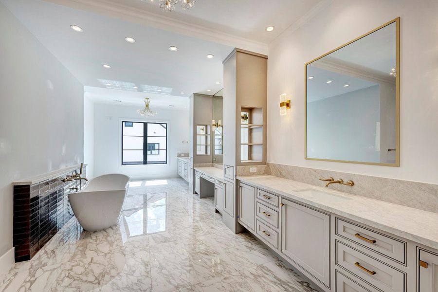 Luxurious primary bathroom. Not pictured is the large tiled shower.