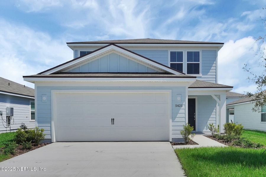 Front exterior of a new home in Wells Landing, Jacksonville, FL, highlighting curb appeal (Image 1).