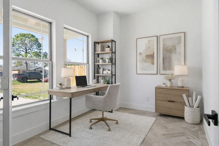As you step inside, you’ll find a bright flex space to the left, filled with natural light, a ceiling fan, and luxury vinyl flooring—perfect for an office, playroom, or whatever fits your lifestyle. (staged)