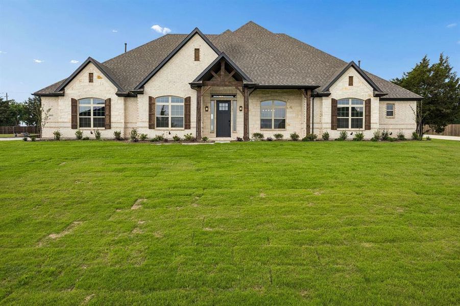 Front exterior of a new home in Oak Creek Ranch, Midlothian, TX, highlighting curb appeal (Image 2). Front exterior of a new home in Oak Creek Ranch, Midlothian, TX, highlighting curb appeal (Image 2).