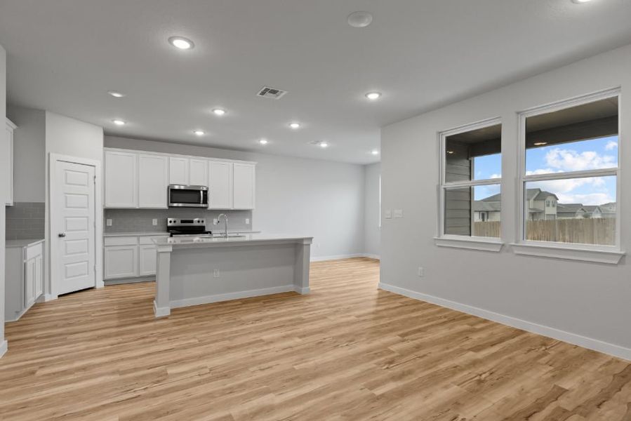 A kitchen with white cabinets. A kitchen with white cabinets.