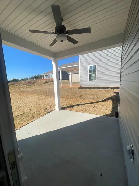 Exterior details and patio area of a home in Springwood Grove, Central (Image 4).