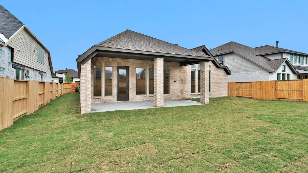 Exterior details and patio area of a home in Meridiana, Manvel (Image 4).