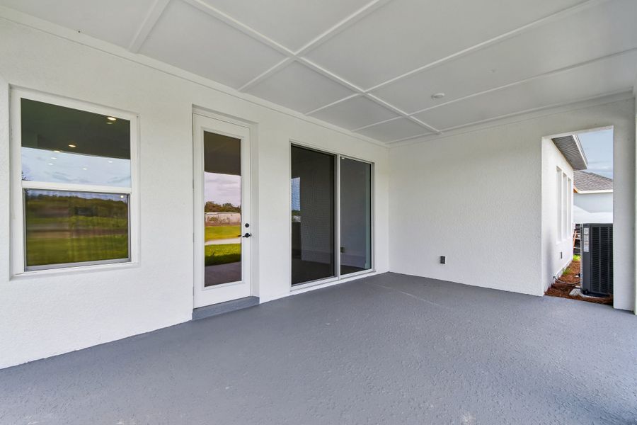 Exterior details and patio area of a home in Oakfield at Mount Dora Village Series, Mount Dora (Image 3).