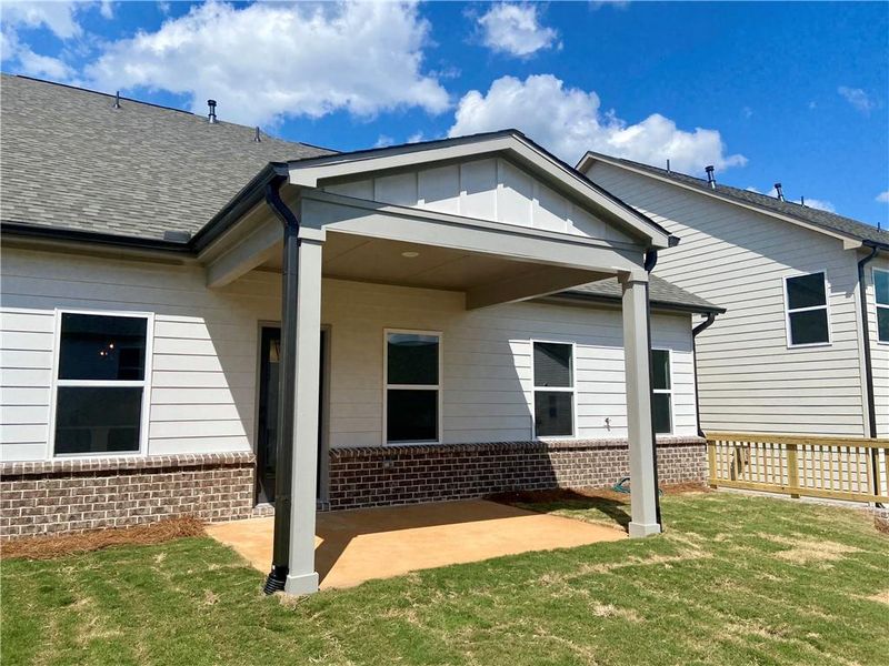 Exterior details and patio area of a home in Eastlyn Crossing, Flowery Branch (Image 18).
