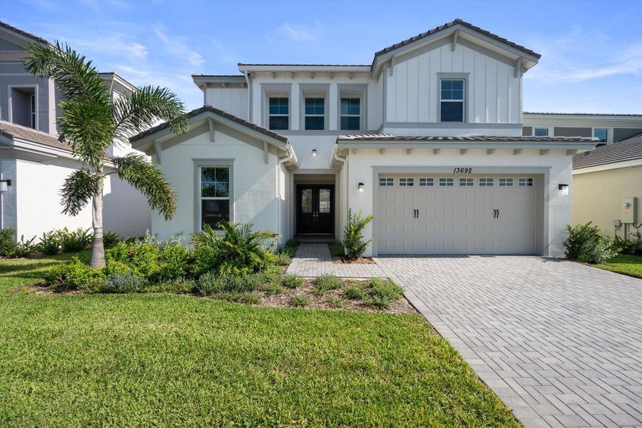 Front exterior of a new home in , Westlake, FL, highlighting curb appeal (Image 28). Front exterior of a new home in , Westlake, FL, highlighting curb appeal (Image 28).