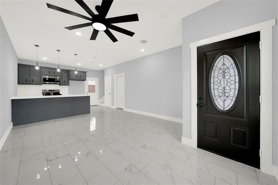 This home has ceramic tiles on the first floor and in the bbathrooms. The tiles are a light color, which makes the rooms feel larger and brighter.